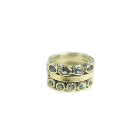 Firmas de moda ANILLO DE PLATA Y ORO CON TOPACIO AZUL Styliano Firmas de moda ANILLO DE PLATA Y ORO CON TOPACIO AZUL Styliano